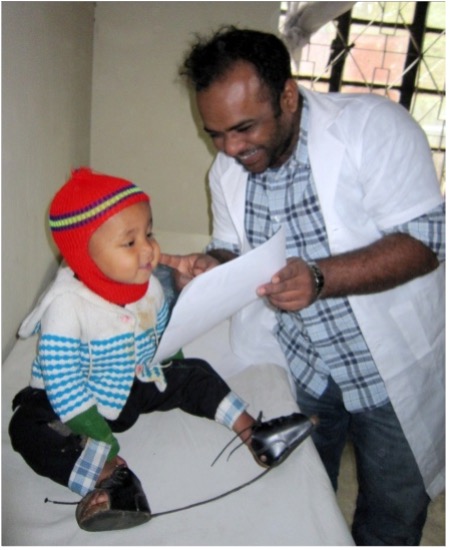 A child fitted with a corrective brace
